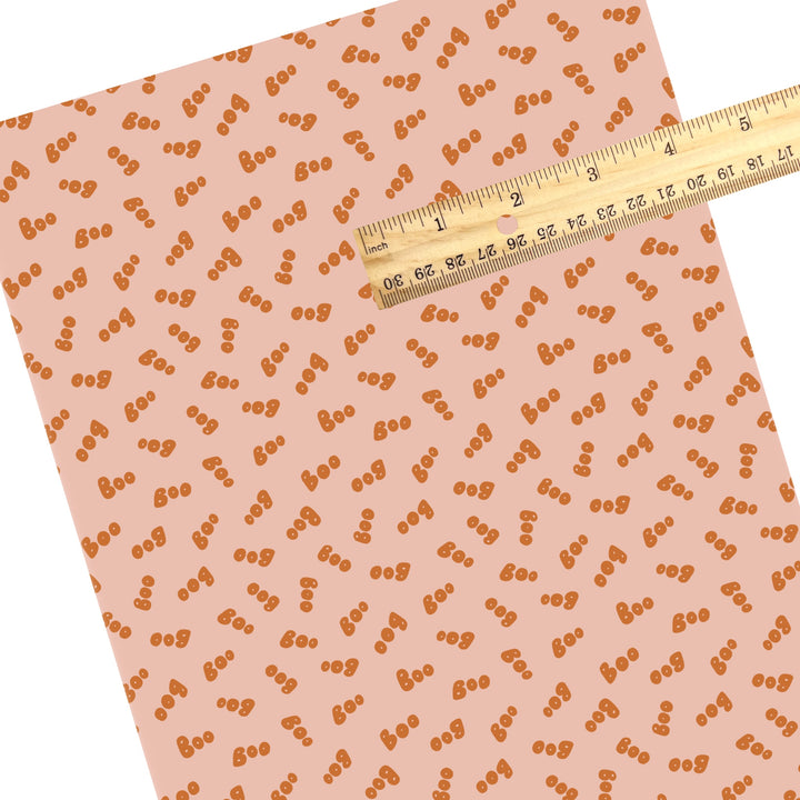 These Halloween themed pattern faux leather sheets contain the following design elements: orange "BOO" on light pink. Our CPSIA compliant faux leather sheets or rolls can be used for all types of crafting projects.