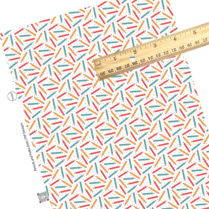 Scattered matching dots and pencils on white faux leather sheets