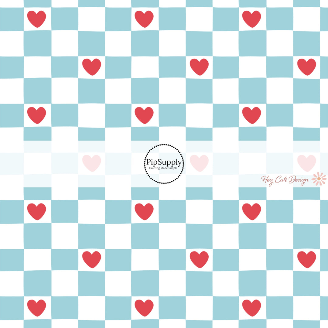 This holiday fabric by the yard features blue and white checker pattern with red hearts. This festive pattern fabric can be used for all your sewing and crafting needs!