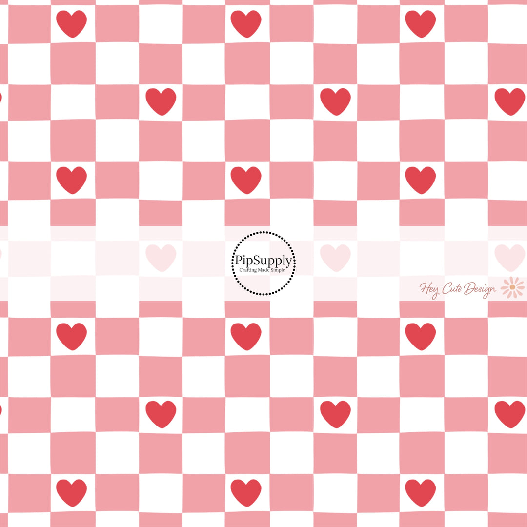 This holiday fabric by the yard features pink and white checker pattern with red hearts. This festive pattern fabric can be used for all your sewing and crafting needs!