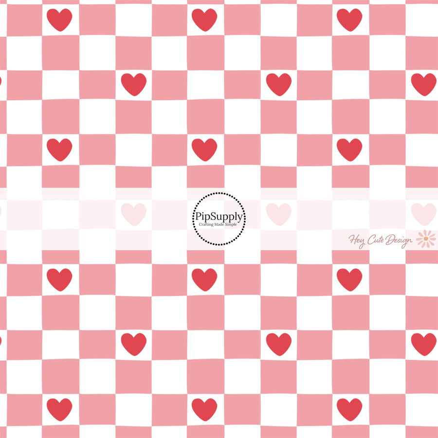 This holiday fabric by the yard features pink and white checker pattern with red hearts. This festive pattern fabric can be used for all your sewing and crafting needs!