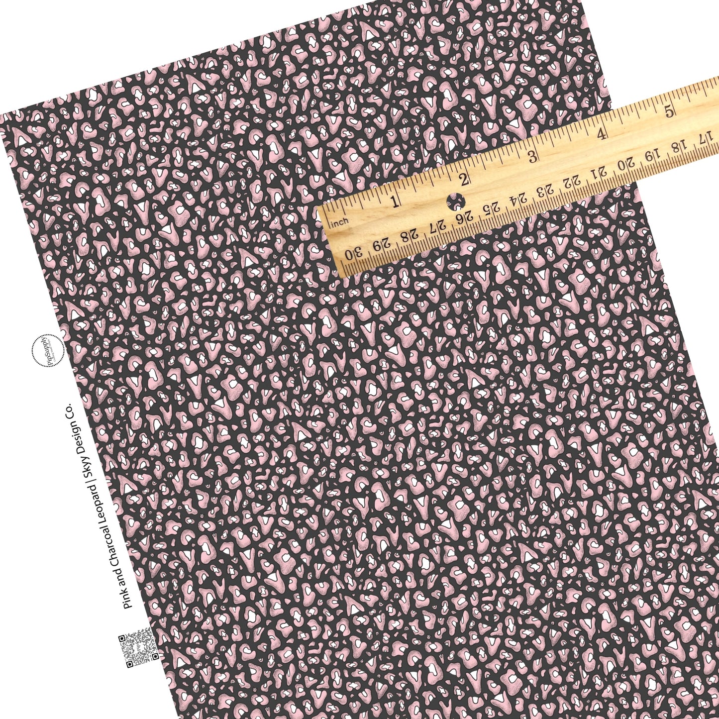 Scattered pink leopard print on charcoal faux leather sheets