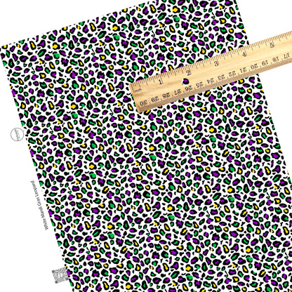 Purple, yellow, and green leopard print on white faux leather sheets