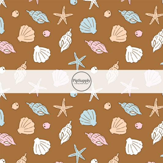 This beach fabric by the yard features seashells on brown. This fun summer themed fabric can be used for all your sewing and crafting needs!