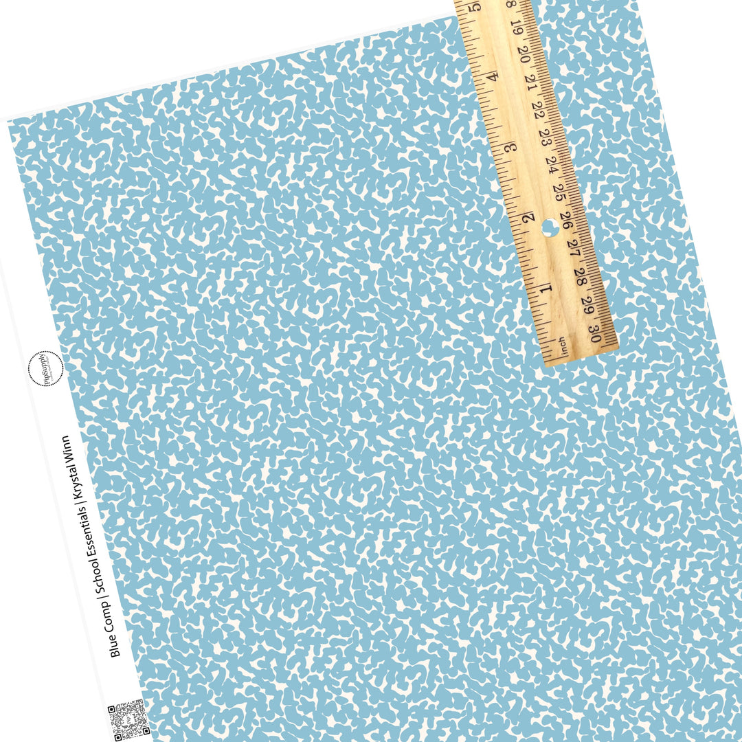 Blue spots on cream compostion book faux leather sheets