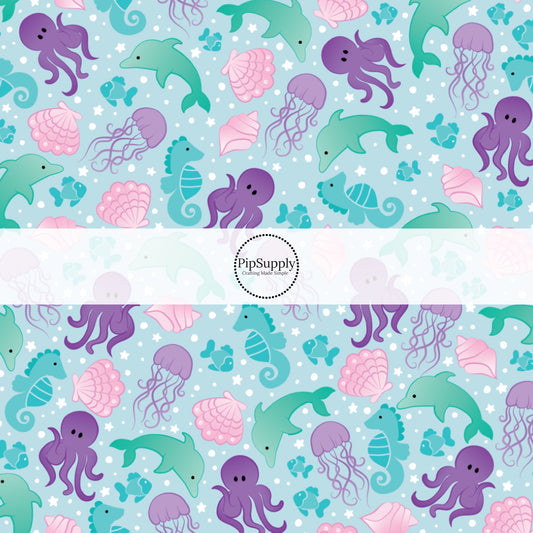 This ocean fabric by the yard features sea creatures on blue. This fun summer themed fabric can be used for all your sewing and crafting needs!