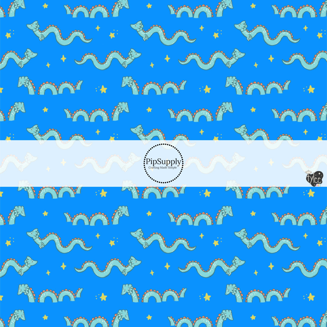 These bright ocean themed fabric by the yard features sea monsters on blue. This fun pattern fabric can be used for all your sewing and crafting needs!