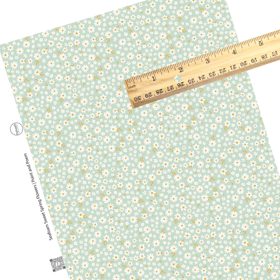 These spring pattern themed faux leather sheets contain the following design elements: tiny flowers on seafoam. Our CPSIA compliant faux leather sheets or rolls can be used for all types of crafting projects.