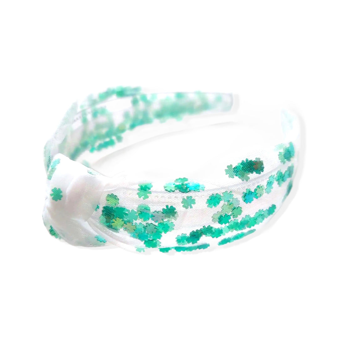 These St. Patrick's Day tulle knotted headbands are a stylish hair accessory having the look of a knotted headwrap and the on and off ease of a headband. Made with high quality fabric these headbands are a perfect simple and fashionable answer to keeping your hair back! Between the tulle and headband are shamrock sequins.