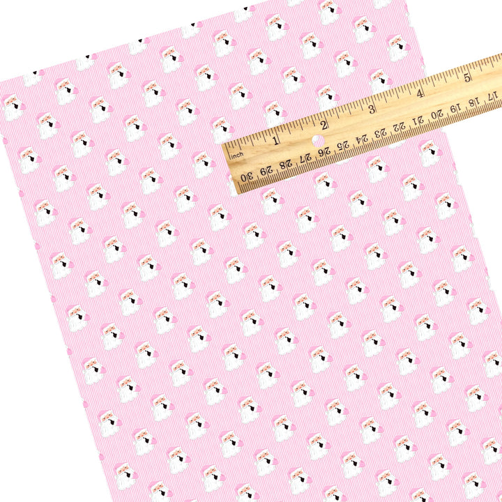 These Santa themed pattern faux leather sheets contain the following design elements: Santa surrounded by pink and white Christmas stripes. Our CPSIA compliant faux leather sheets or rolls can be used for all types of crafting projects.