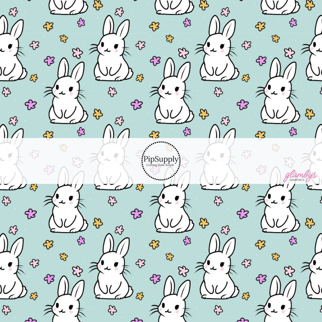 This Easter themed fabric by the yard features white Easter bunnies surrounded by tiny flowers on aqua. This fun pattern fabric can be used for all your sewing and crafting needs!