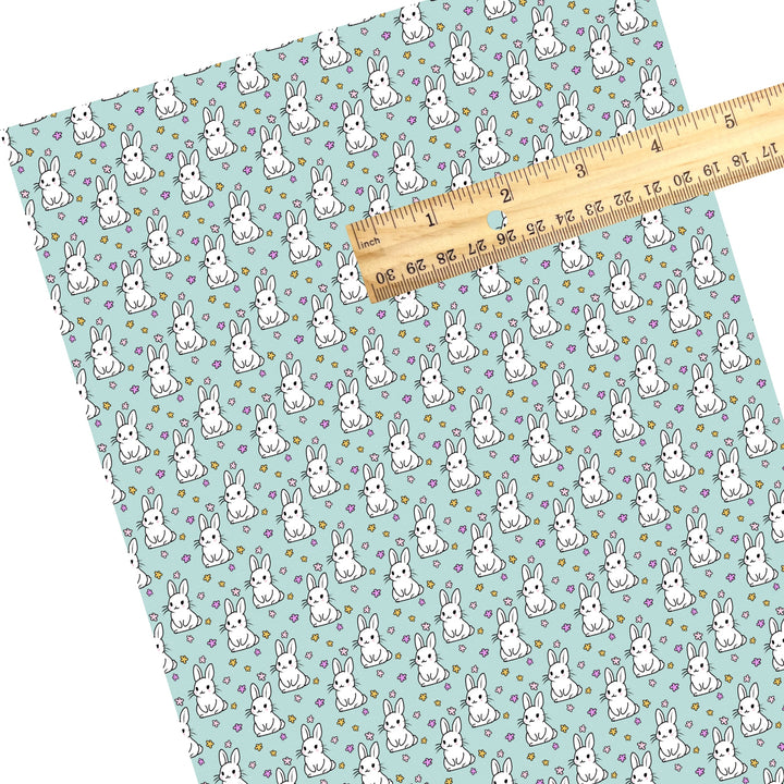 These Easter themed faux leather sheets contain the following design elements: white Easter bunnies surrounded by tiny flowers on aqua. Our CPSIA compliant faux leather sheets or rolls can be used for all types of crafting projects.