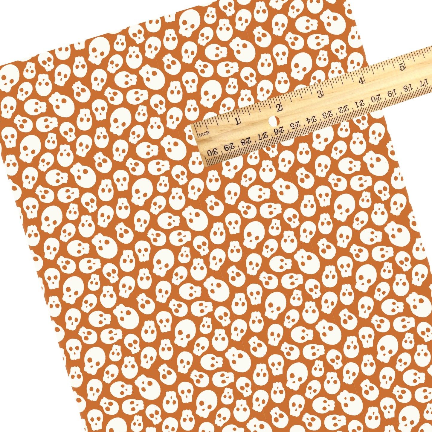 These Halloween themed pattern faux leather sheets contain the following design elements: cream skulls on orange. Our CPSIA compliant faux leather sheets or rolls can be used for all types of crafting projects.