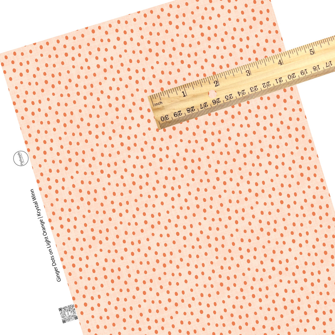 These orange  faux leather sheets contain the following design elements: small dark orange dots on light orange. 