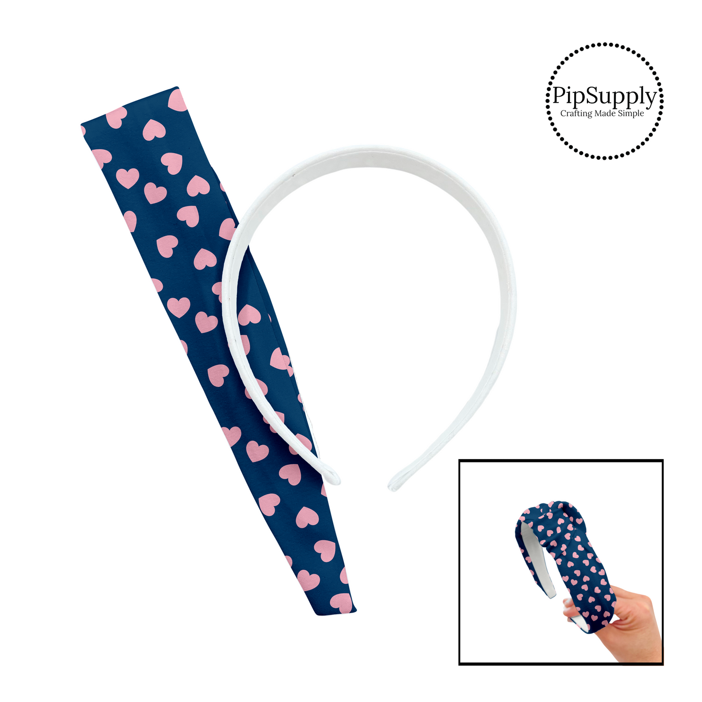 Light pink hearts in various directions on navy blue DIY knotted headband kit.