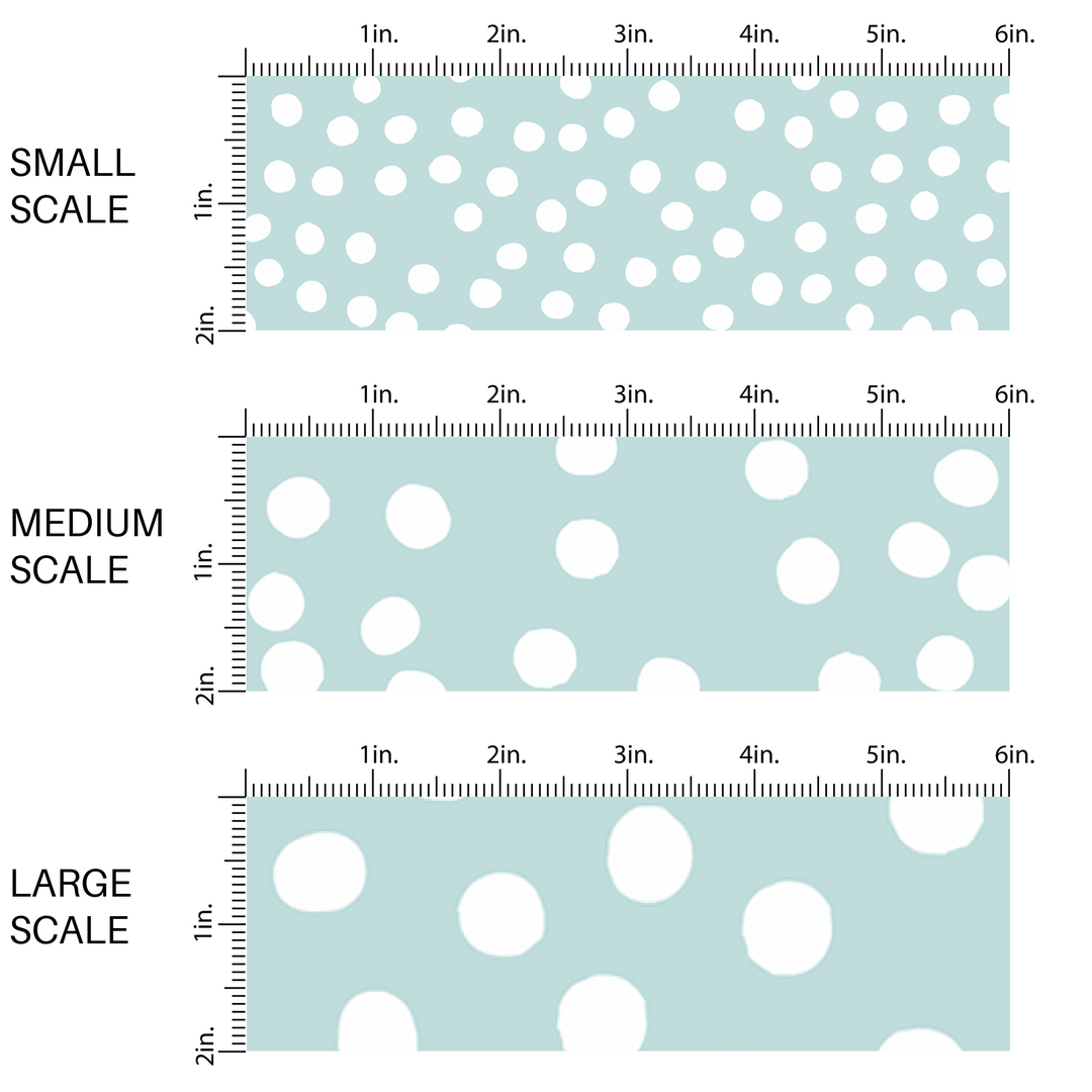 This scale chart with small scale, medium scale, and large scale of small dots on a light teal fabric by the yard features small dots in white scattered on a teal blue background.