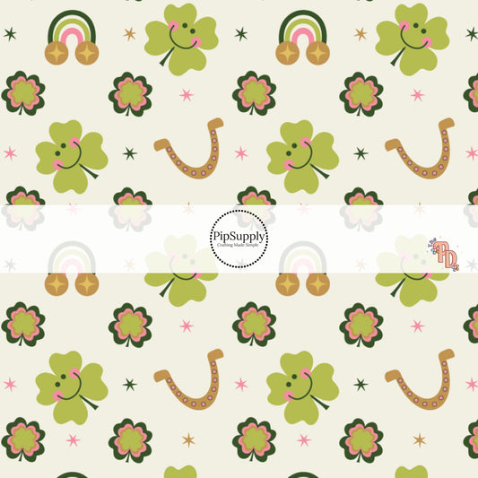 Smiling Clovers, Rainbows, and Horseshoes on Pale Green Fabric by the Yard.