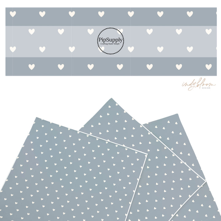 These summer faux leather sheets contain the following design elements: tiny cream hearts on light blue. Our CPSIA compliant faux leather sheets or rolls can be used for all types of crafting projects.