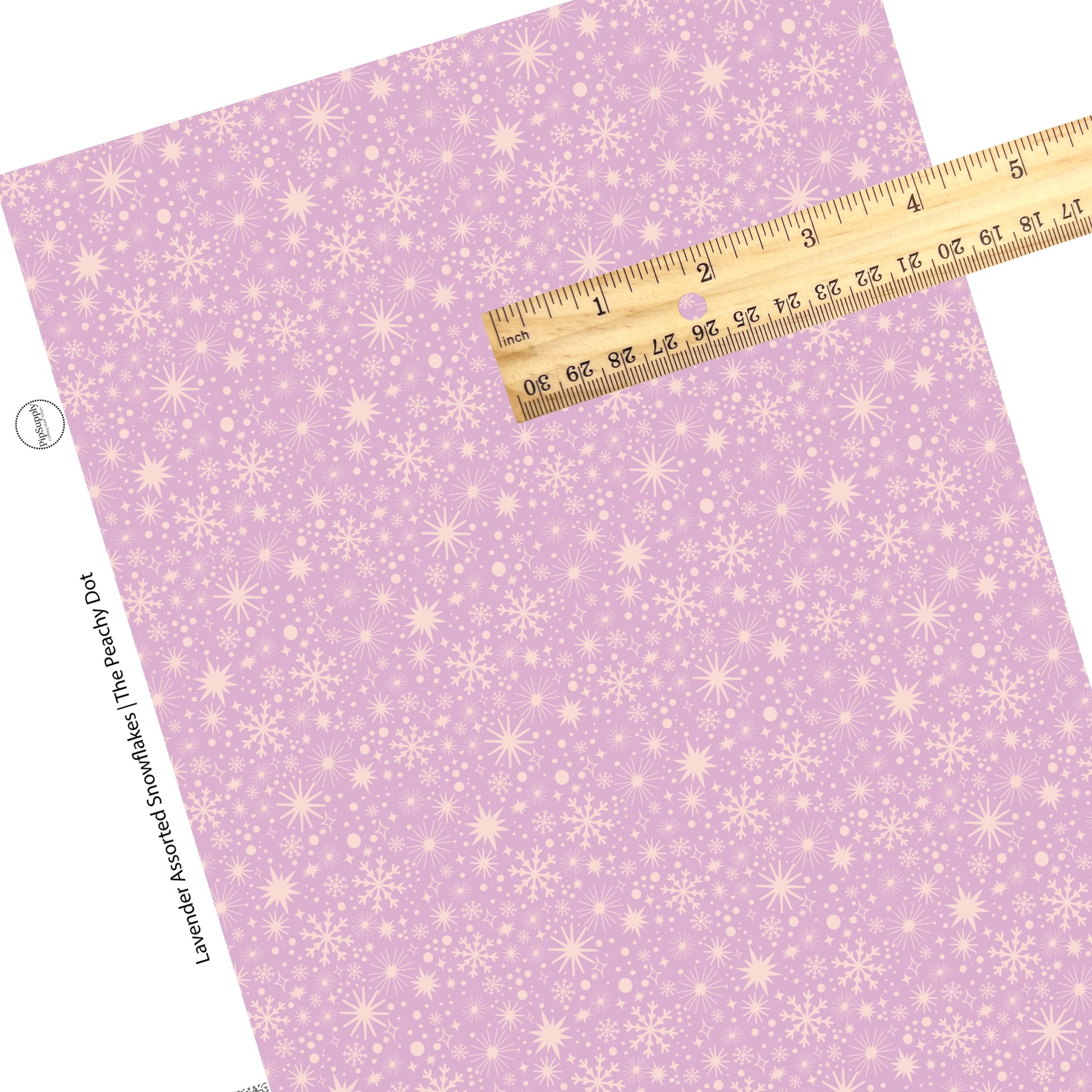 Scattered light purple snowflakes on lavender faux leather sheets