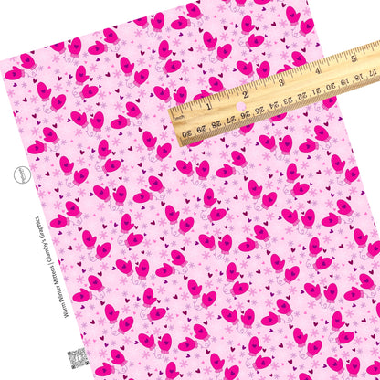 Snowflakes with mittens and hearts on pink faux leather sheets