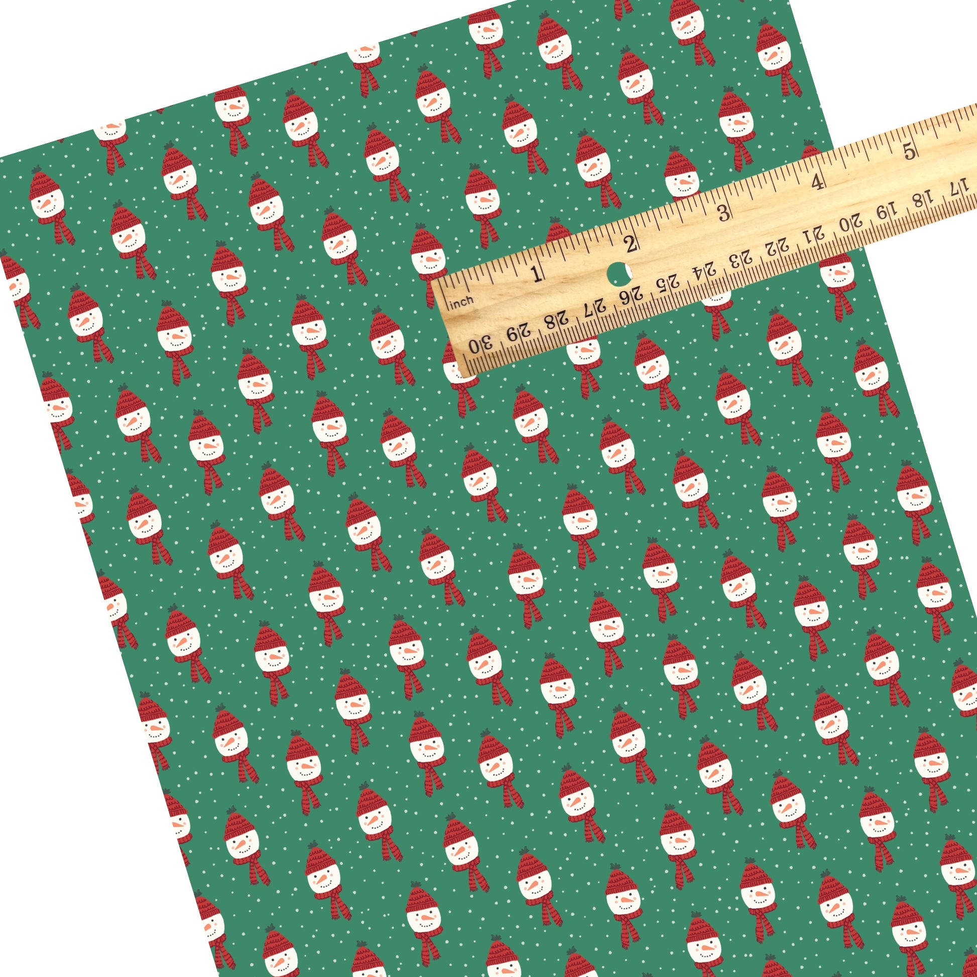 These Christmas snowmen themed pattern faux leather sheets contain the following design elements: snowmen with red hats and scarves surrounded by dots on green. Our CPSIA compliant faux leather sheets or rolls can be used for all types of crafting projects.