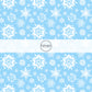 These Santa themed pattern fabric by the yard features the following design elements: white snowflakes on blue. This fun themed fabric can be used for all your sewing and crafting needs!