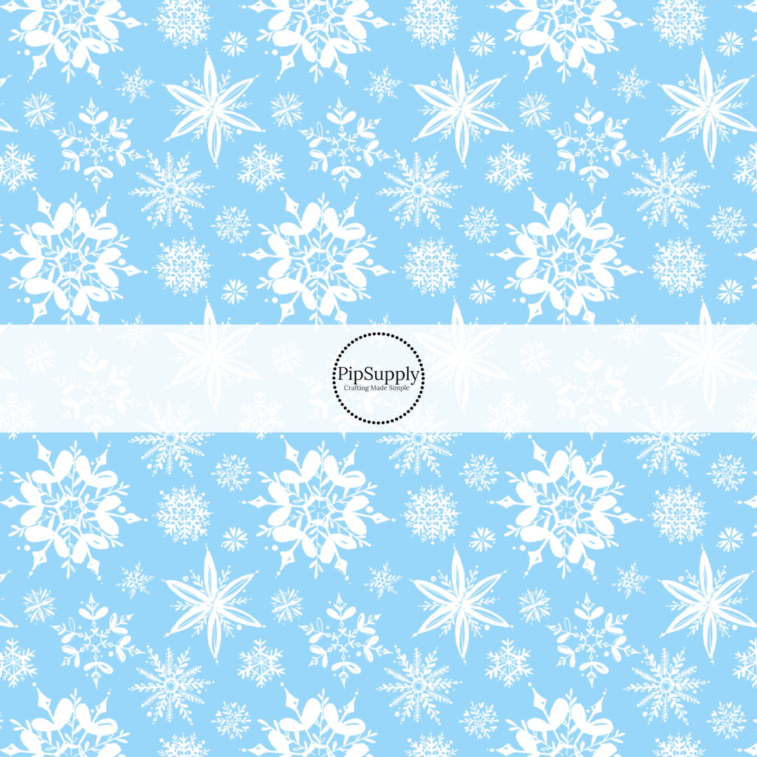 These Santa themed pattern fabric by the yard features the following design elements: white snowflakes on blue. This fun themed fabric can be used for all your sewing and crafting needs!