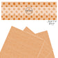 Orange dots on beige faux leather sheets