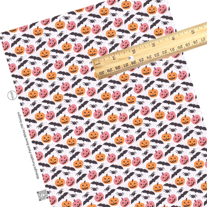 Scattered bats and spiders with pumpkins on white faux leather sheets