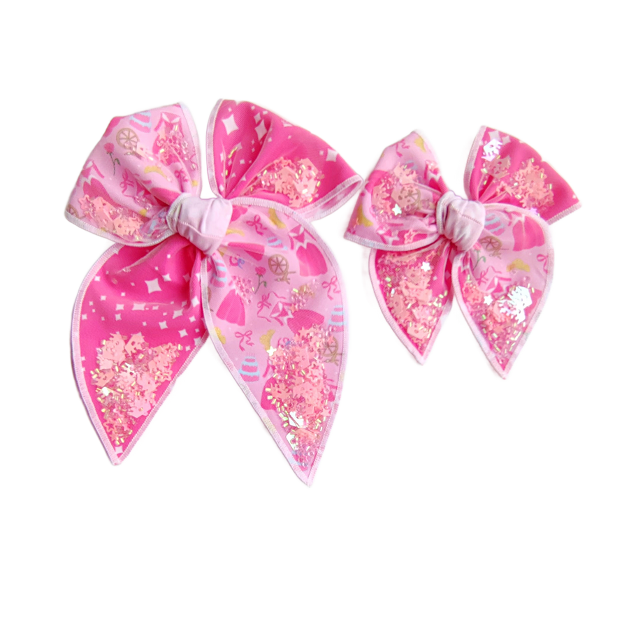 These princess themed shaker two toned pre-cut tied bows are ready to package and resell to your customers no sewing or measuring necessary! These hair bows come with a clip already attached. The shaker bows come pre-filled with princess inspired pattern mix.