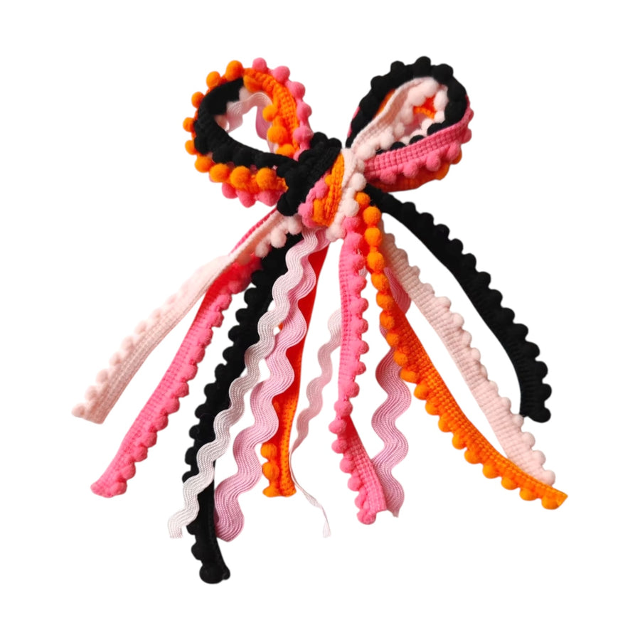 These Halloween colored messy ribbon tied bows are ready to package and resell to your customers no sewing or measuring necessary! These hair bows come with a clip already attached.