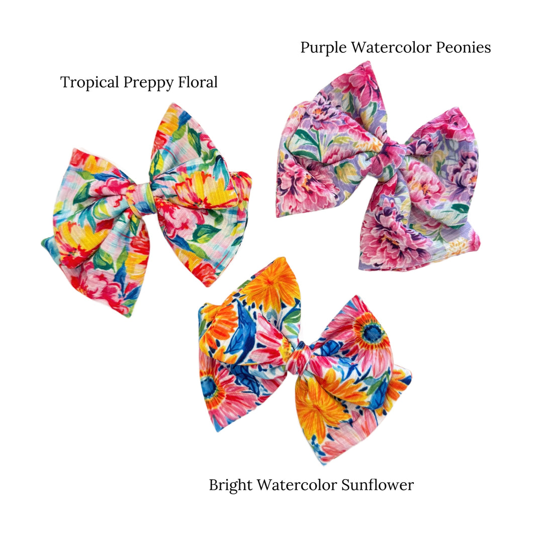 These spring floral DIY bows can be quickly cut and assembled for a trendy spring bow. They're ideal for easy at-home styling, individual use, or even resale. Get creative and add a splash of color to your look with these low-maintenance bows.