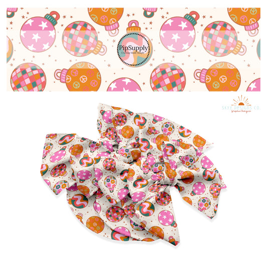Pink, green, and orange Ornaments with stars, peace signs, waves, disco, and flowers on cream starry hair bow strips