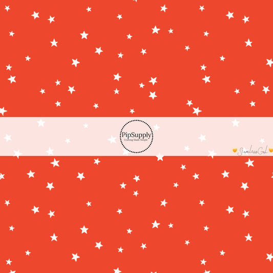 These winter themed pattern fabric by the yard features the following design elements: white tiny stars on red. This fun themed fabric can be used for all your sewing and crafting needs!