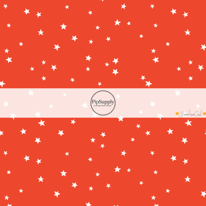 These winter themed pattern fabric by the yard features the following design elements: white tiny stars on red. This fun themed fabric can be used for all your sewing and crafting needs!