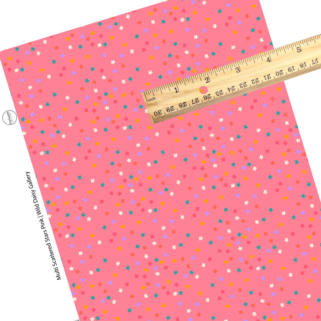 Scattered bright colored stars on pink faux leather sheets