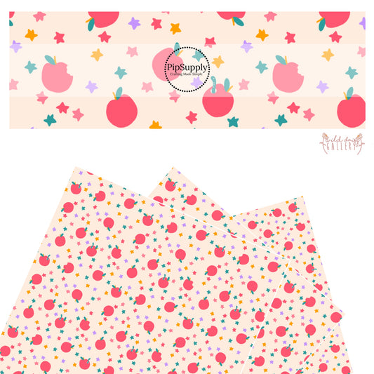 Red apples with multi colored stars on cream faux leather sheets