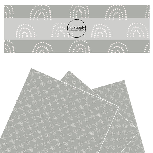 These spring rainbows faux leather sheets contain the following design elements: dotted rainbows on stone gray. Our CPSIA compliant faux leather sheets or rolls can be used for all types of crafting projects. 