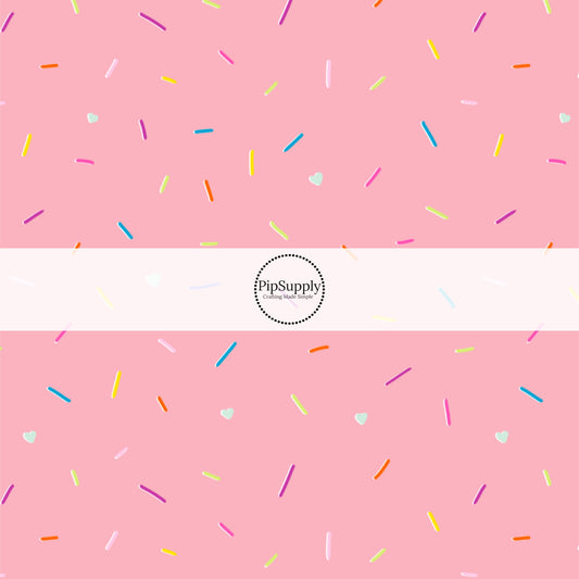 This ice cream sprinkles fabric by the yard features strawberry sprinkles on pink ice cream. This fun themed fabric can be used for all your sewing and crafting needs!