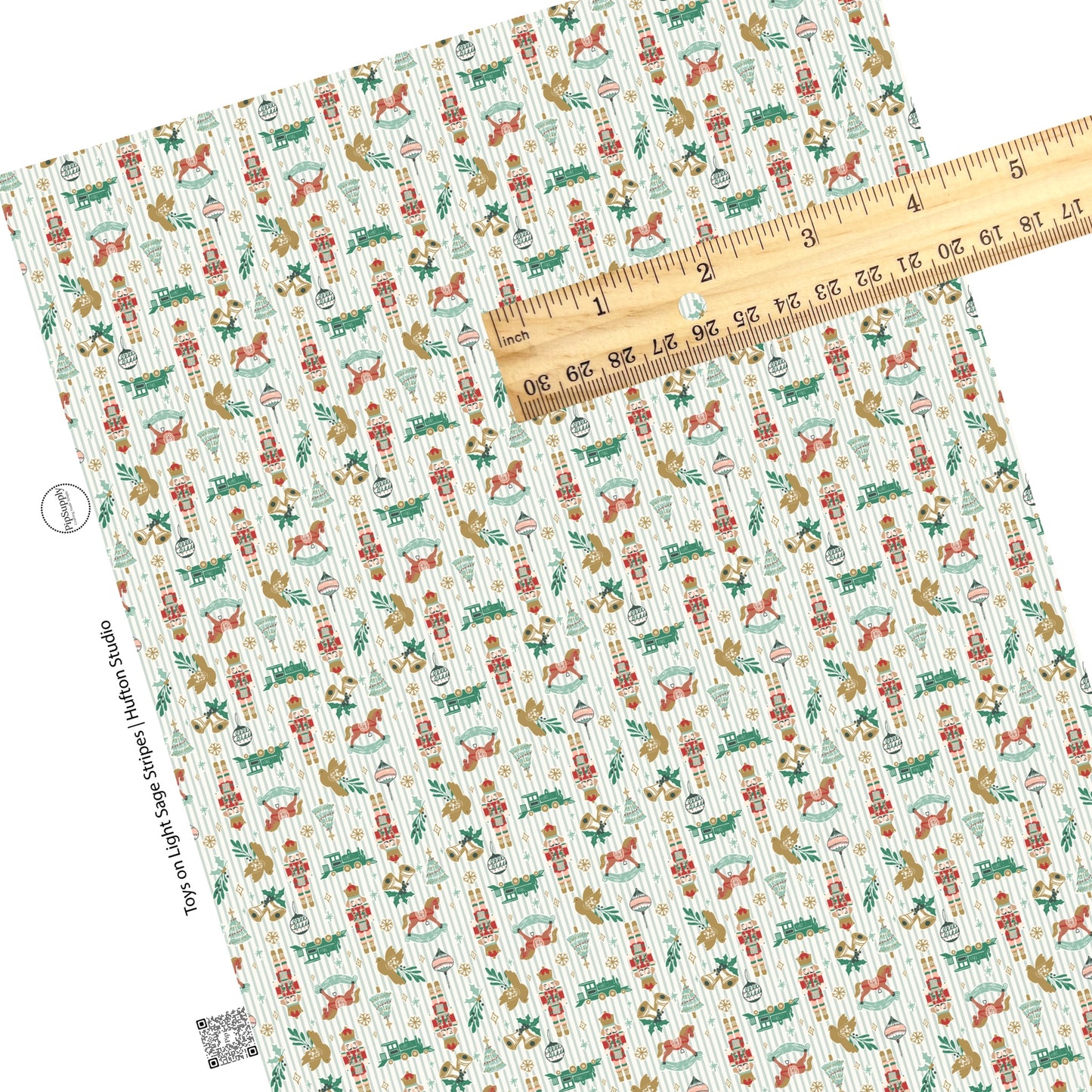 Christmas toys on light green and white stripe faux leather sheets