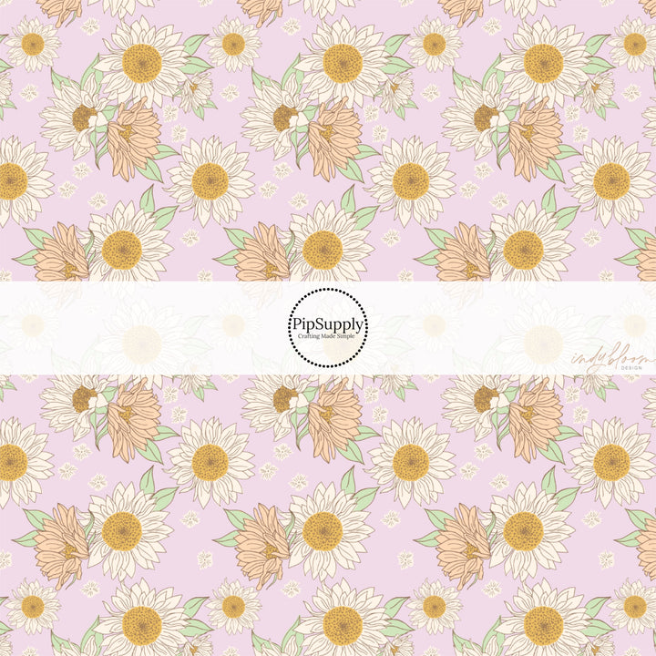 These spring fabric by the yard features lilac sunflowers on lilac. This fun pattern fabric can be used for all your sewing and crafting needs!