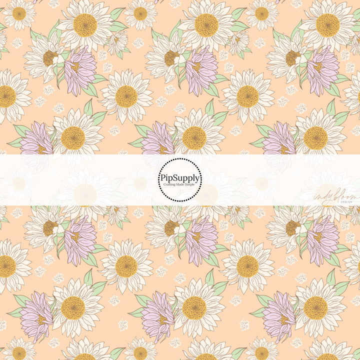 These spring fabric by the yard features lilac sunflowers on peach. This fun pattern fabric can be used for all your sewing and crafting needs!