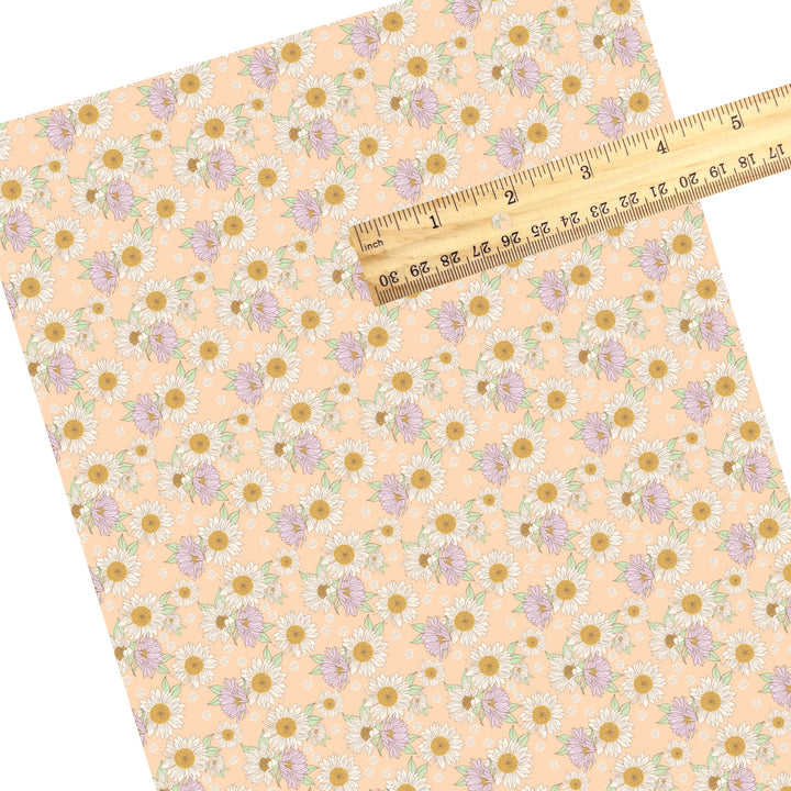 These spring themed faux leather sheets contain the following design elements: sunflowers on peach. Our CPSIA compliant faux leather sheets or rolls can be used for all types of crafting projects.