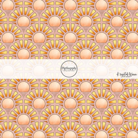 These small suns with ombre colors on light blush fabric by the yard features small sunsets with ombre red, orange and yellow rays. 