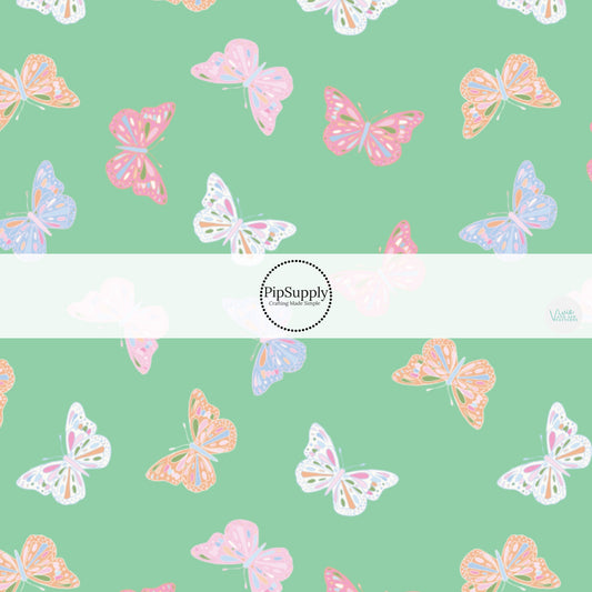 Pink, Blue, and Orange Butterflies on Mint Green Fabric by the Yard.