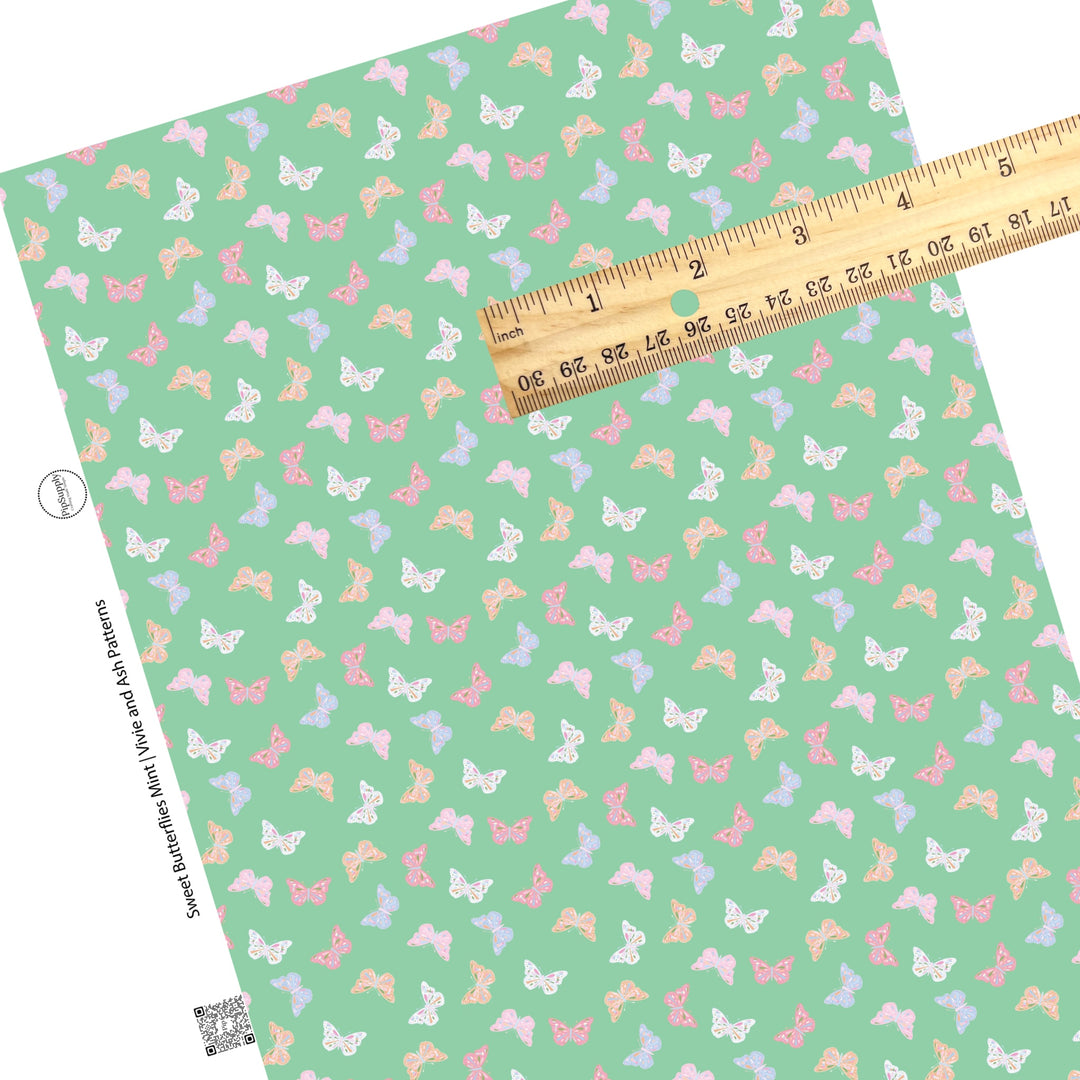 These spring pattern themed faux leather sheets contain the following design elements: pastel butterflies on green. Our CPSIA compliant faux leather sheets or rolls can be used for all types of crafting projects.