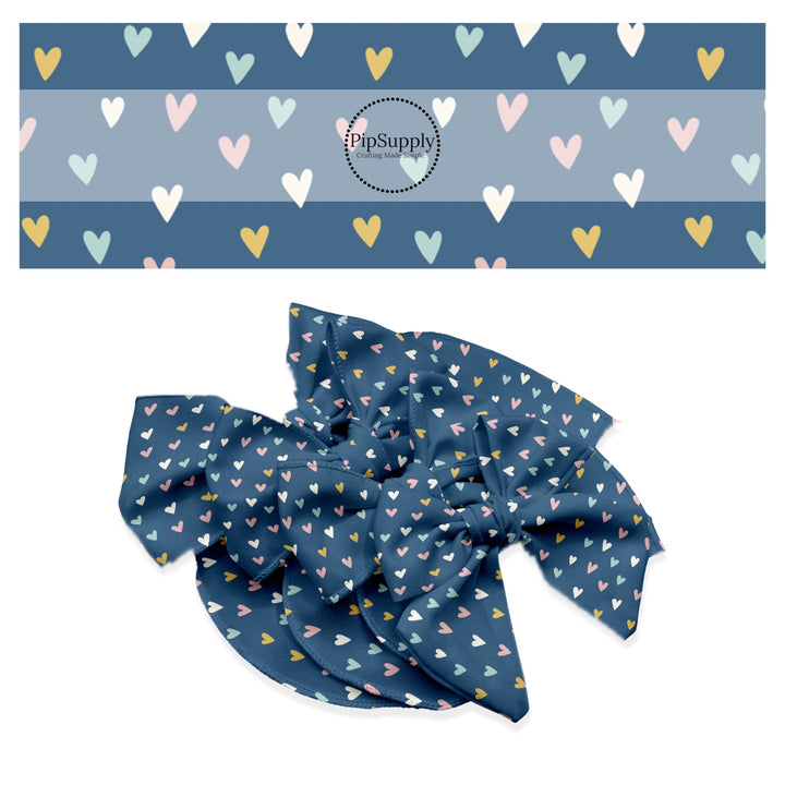 These spring pattern themed no sew bow strips can be easily tied and attached to a clip for a finished hair bow. These patterned bow strips are great for personal use or to sell. These bow strips features light pink, light blue, yellow, and cream hearts on dark blue. 