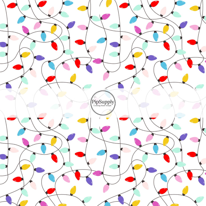 These Santa themed pattern fabric by the yard features the following design elements: colorful Christmas lights on white. This fun themed fabric can be used for all your sewing and crafting needs!