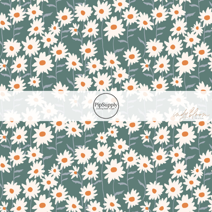 This summer fabric by the yard features cream daisy flowers on teal. This fun summer themed fabric can be used for all your sewing and crafting needs!