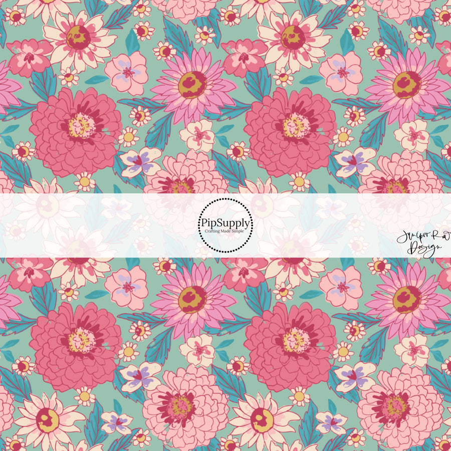 This summer fabric by the yard features pink flowers on teal. This fun summer themed fabric can be used for all your sewing and crafting needs!